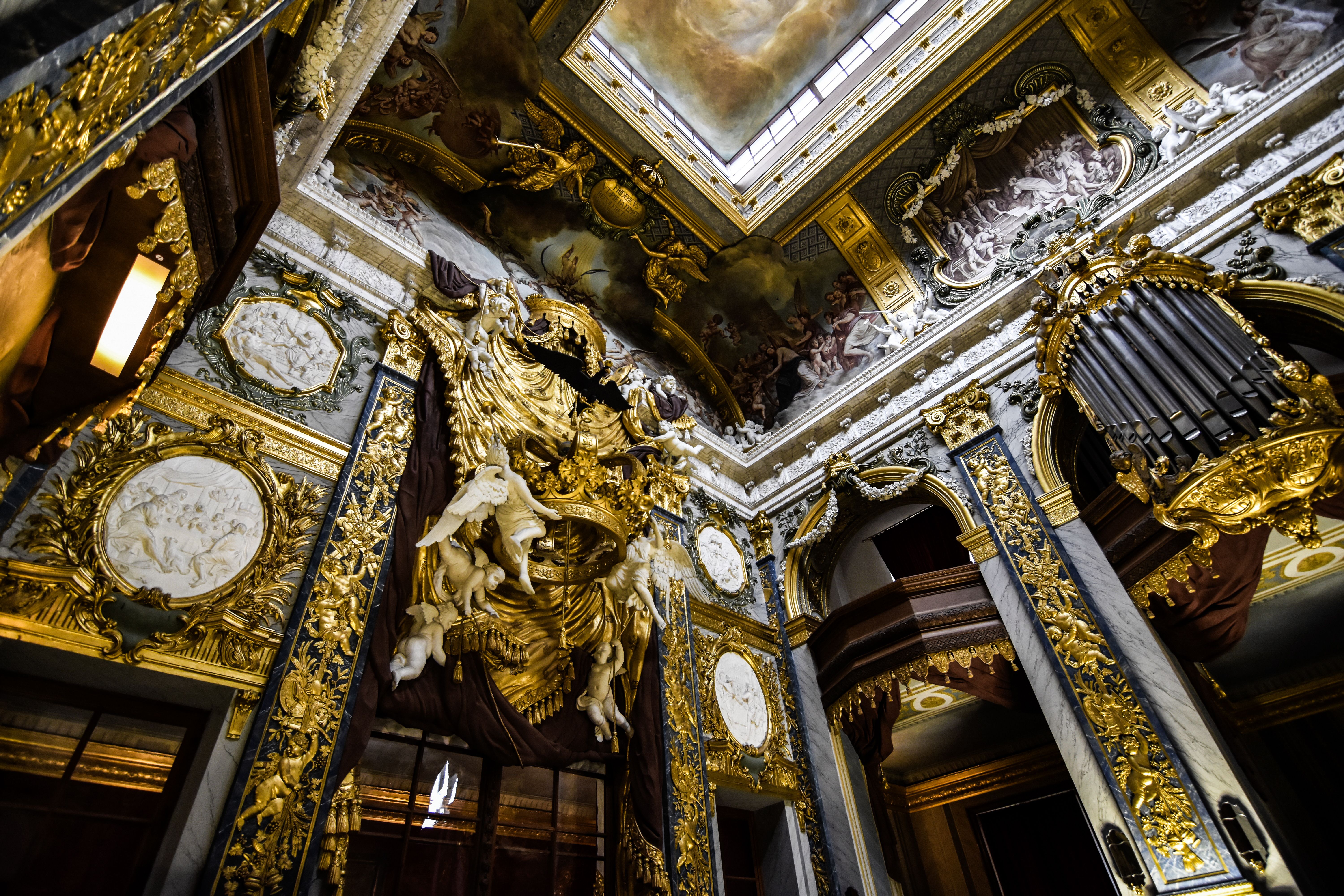 Intricate Baroque architecture with lavish gold details in a grand European palace interior